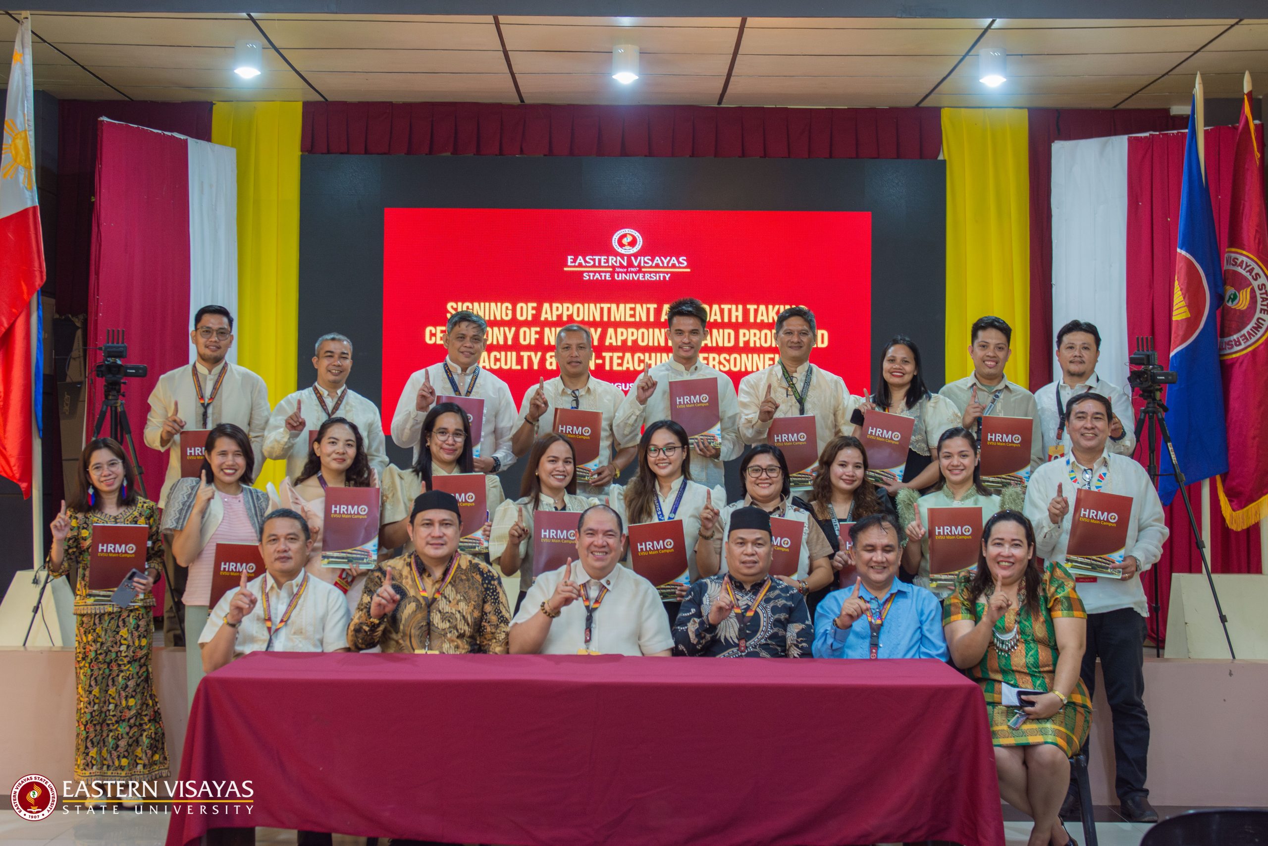 Newly appointed EVSU personnel and promoted faculty take oath during flag-raising