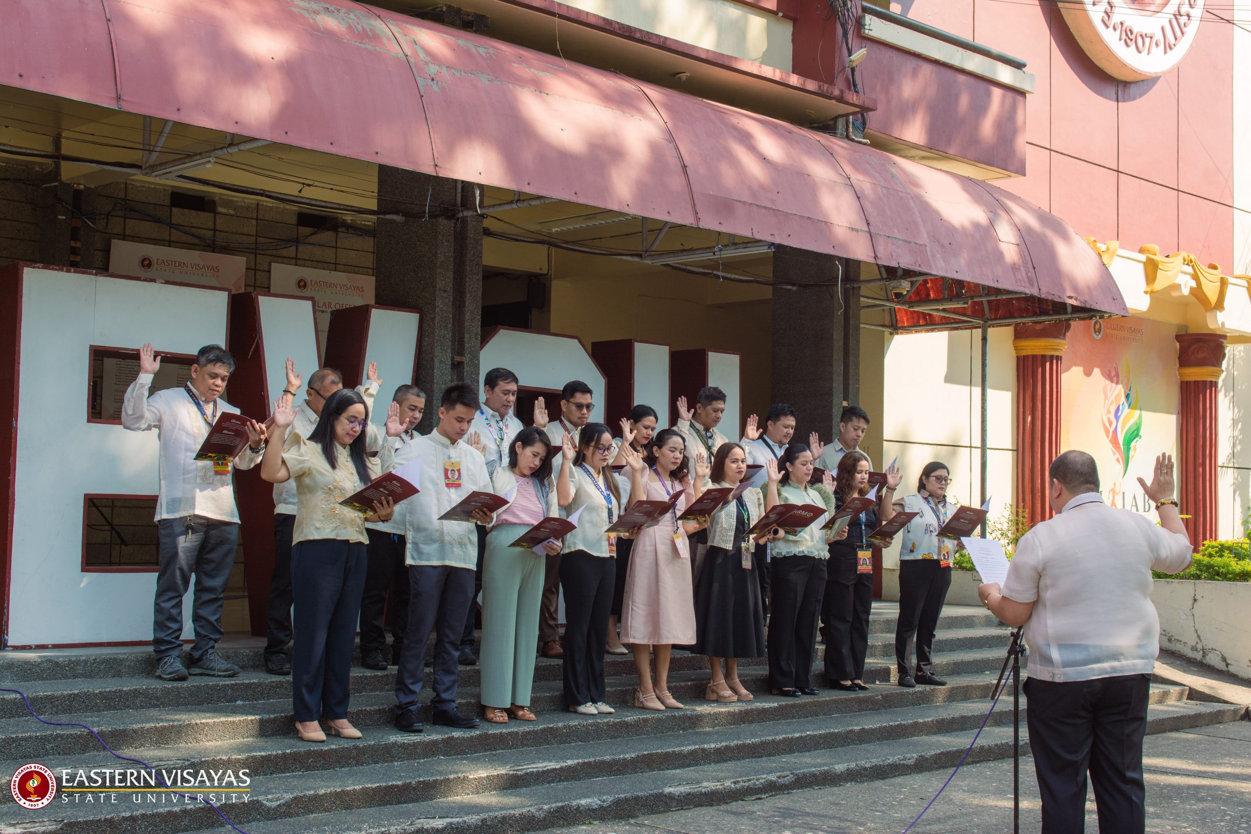 Newly appointed EVSU personnel and promoted faculty take oath during flag-raising