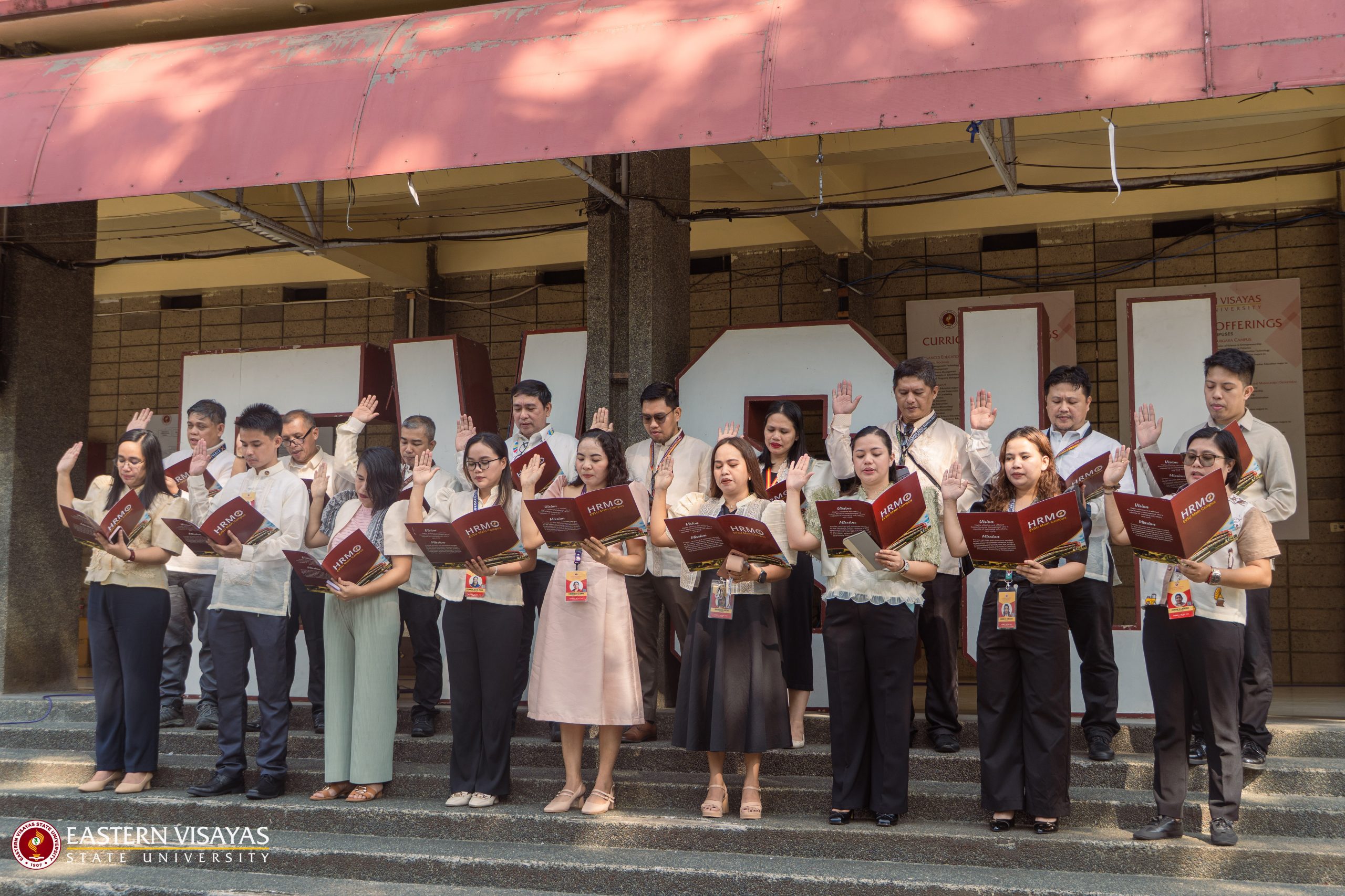 Newly appointed EVSU personnel and promoted faculty take oath during flag-raising